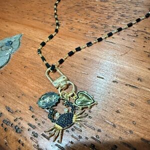 New. Never worn. Handmade Elegant Black and Gold Pendant Necklace